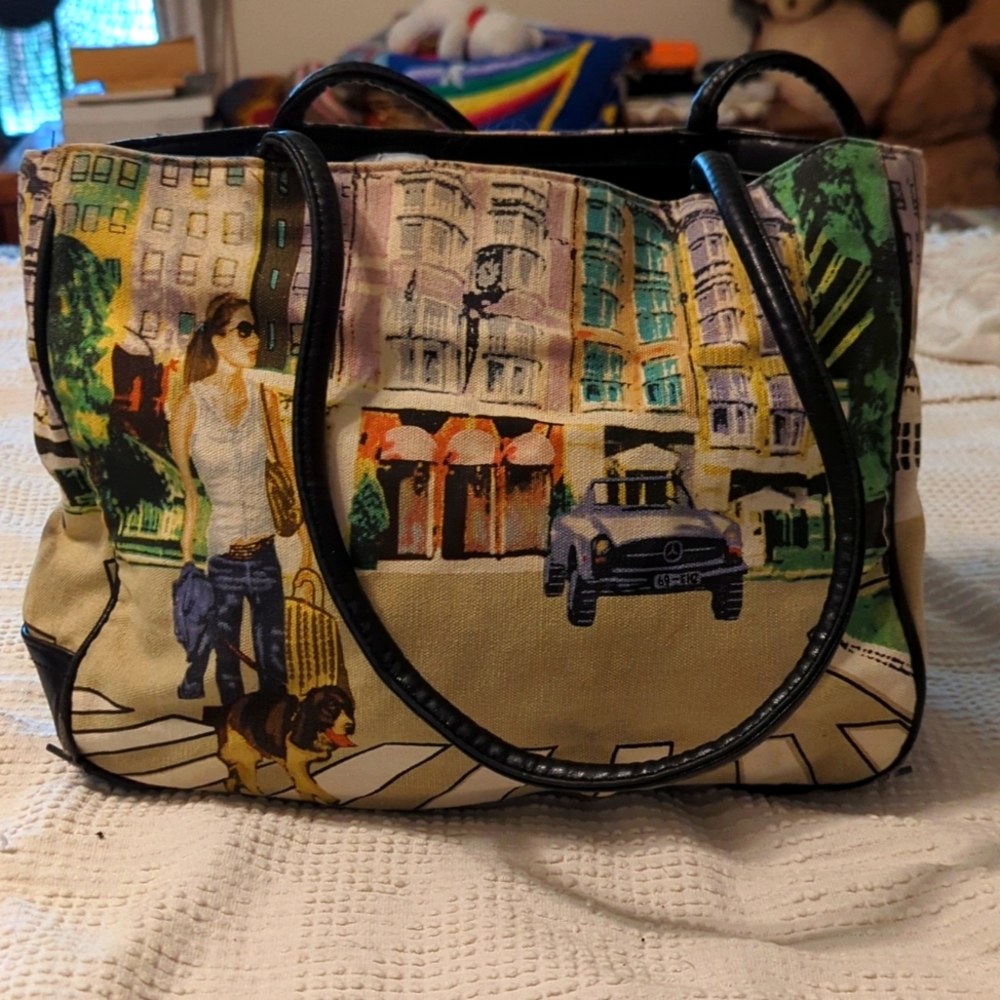 Shoulder bag with city scene and woman walking dog